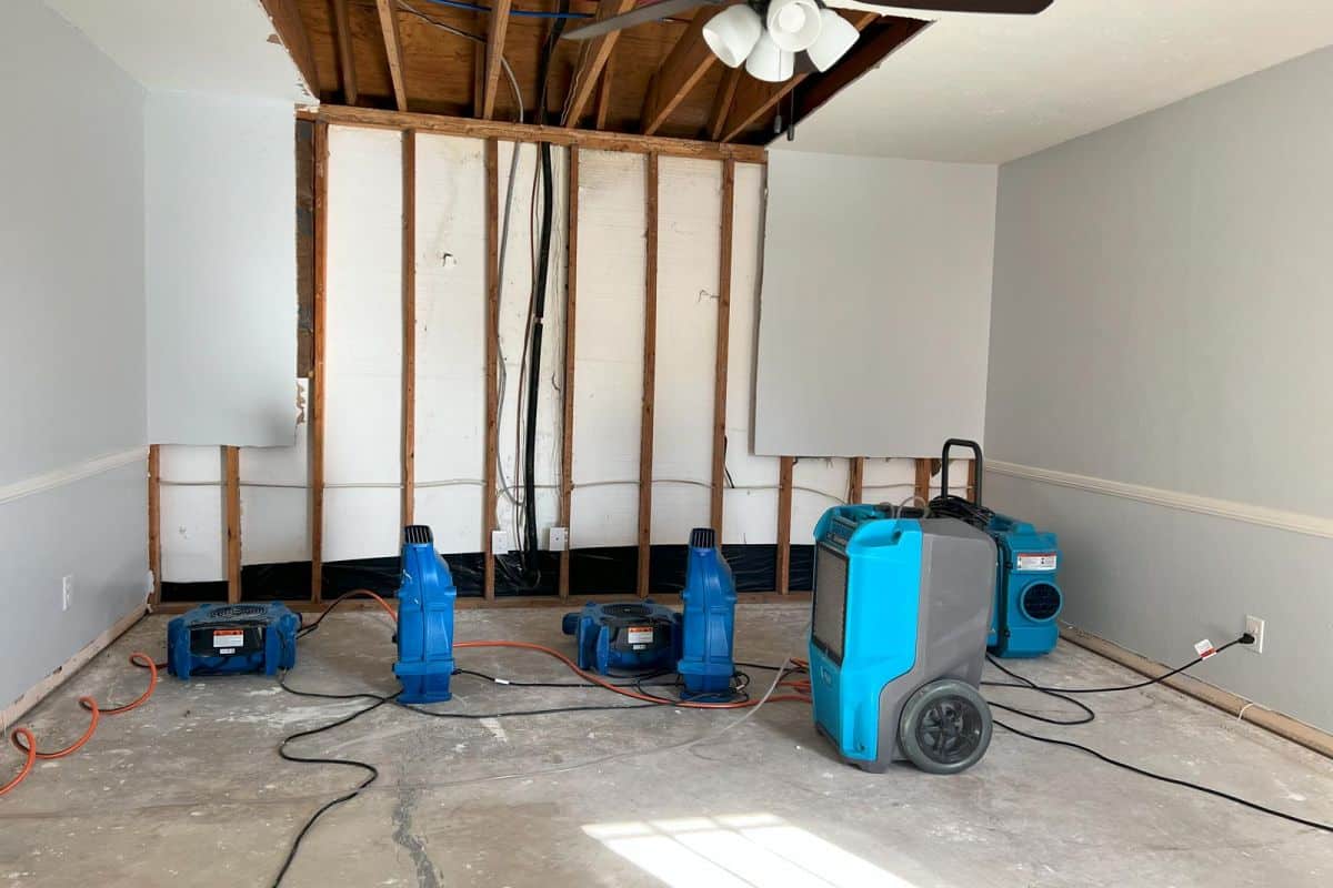 Drying equipment placed after damaged drywall has been removed